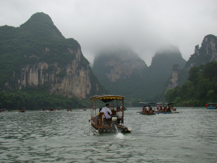Cruising down the Li River on a powered bamboo raft