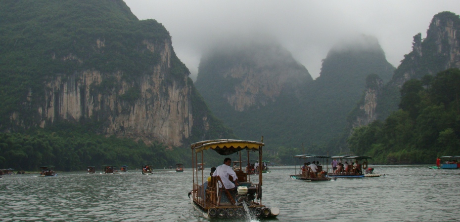 Cruising down the Li River on a powered bamboo raft