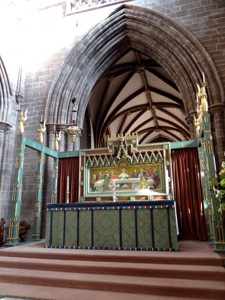 The Chancel- the High Altar has a reredos by J.R. Clayton of Clayton and Bell, and a seasonal altar frontal in the Art Nouveau style.