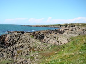 Walking along the rocky coastline of Wales
