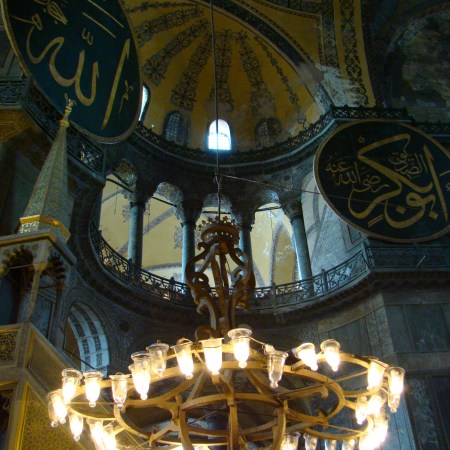 Interior view of the Hagia Sophia, showing Islamic elements on the top of the main dome.
